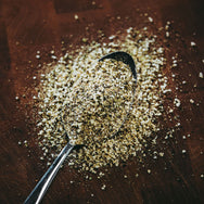 Colden's Freakin' Greek Rub on spoon showing the spice out of bottle.