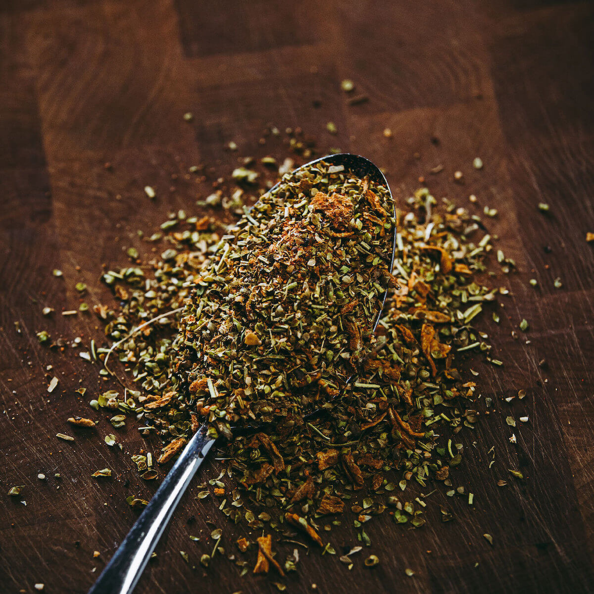 Ray's Loco Gringo Southwest Seasoning on spoon showing the spice out of bottle. 